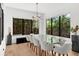 Dining room featuring natural light and a glass table with seating for eight at 2803 W Aquilla St, Tampa, FL 33629