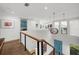Hallway with wood floors, stylish lighting, and blue accents at 2803 W Aquilla St, Tampa, FL 33629