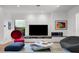 Bright living room with contemporary design, modern fireplace, and access to outdoor views, offering a serene ambiance at 2803 W Aquilla St, Tampa, FL 33629