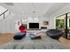 Spacious living room boasts a modern fireplace, stylish seating, and large windows for ample natural light at 2803 W Aquilla St, Tampa, FL 33629