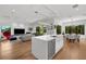 Open-concept living area with island and view of the dining room at 2803 W Aquilla St, Tampa, FL 33629