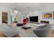 Inviting living room with stylish furniture, a modern fireplace, and an open layout perfect for relaxation and entertainment at 2803 W Aquilla St, Tampa, FL 33629