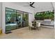Open patio area features a dining table, summer kitchen, and seamless access to the interior at 2803 W Aquilla St, Tampa, FL 33629