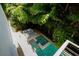 Aerial view of a backyard oasis with a pool, spa, patio and outdoor seating area at 2803 W Aquilla St, Tampa, FL 33629