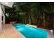 Beautiful backyard with a private pool and spa surrounded by lush landscaping at 2803 W Aquilla St, Tampa, FL 33629
