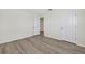 Spacious bedroom featuring wood-look flooring and doorway to other rooms for added convenience at 3125 S Northview Rd, Plant City, FL 33566