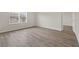 Bright bedroom featuring wood-look floors and a window at 3125 S Northview Rd, Plant City, FL 33566