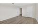 Spacious bedroom featuring wood-look flooring and doorway to other rooms for added convenience at 3125 S Northview Rd, Plant City, FL 33566