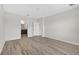 Spacious bedroom features wood-look flooring and an ensuite bathroom for added privacy and convenience at 3125 S Northview Rd, Plant City, FL 33566