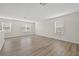 Spacious bonus room with abundant natural light and wood-look flooring at 3125 S Northview Rd, Plant City, FL 33566