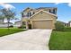 Charming two-story home showcasing a well-maintained lawn and a spacious driveway at 3125 S Northview Rd, Plant City, FL 33566