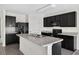 Contemporary kitchen featuring black appliances, an island, and ample cabinet space at 3125 S Northview Rd, Plant City, FL 33566