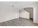 Open living room with wood-look floors and neutral paint at 3125 S Northview Rd, Plant City, FL 33566