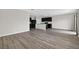 Expansive living space featuring wood-look floors and a modern kitchen at 3125 S Northview Rd, Plant City, FL 33566