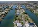 Scenic aerial view of waterfront homes, showcasing canals and community layout at 3243 Azalea Dr, Hernando Beach, FL 34607