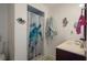 Cozy bathroom featuring a turtle-themed shower curtain, charming decor, and a functional vanity at 3243 Azalea Dr, Hernando Beach, FL 34607