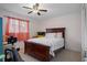 Inviting bedroom with a full bed, natural light, and ceiling fan for a relaxing space at 3243 Azalea Dr, Hernando Beach, FL 34607