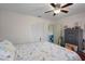 Comfortable bedroom with a full bed, ceiling fan, and plenty of storage in a clean space at 3243 Azalea Dr, Hernando Beach, FL 34607