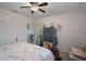 Comfortable bedroom with a full bed, ceiling fan, and plenty of storage in a clean space at 3243 Azalea Dr, Hernando Beach, FL 34607