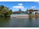View of waterfront backyard with private pool and dock access on canal at 3243 Azalea Dr, Hernando Beach, FL 34607
