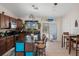 Modern kitchen with granite countertops, stainless steel appliances, and adjacent dining area at 3243 Azalea Dr, Hernando Beach, FL 34607
