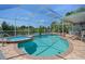 Canal-front pool area features a clear pool, a relaxing hot tub, a screened lanai, and comfortable patio seating for outdoor enjoyment at 3243 Azalea Dr, Hernando Beach, FL 34607