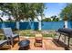Backyard with patio furniture and vibrant blue fence, perfect for outdoor gatherings at 3350 Fox Hunt Dr, Palm Harbor, FL 34683