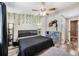 Comfortable bedroom featuring stylish décor, neutral walls, ceiling fan and ample space at 3350 Fox Hunt Dr, Palm Harbor, FL 34683