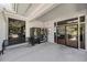 Inviting clubhouse entrance with vending machines, seating, and glass doors for a peek inside the Fox Chase community at 3350 Fox Hunt Dr, Palm Harbor, FL 34683