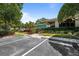 Image of leasing office, well-manicured landscaping, and staff parking at 3350 Fox Hunt Dr, Palm Harbor, FL 34683