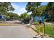 Entrance to Fox Chase featuring a well-manicured entrance and gated access at 3350 Fox Hunt Dr, Palm Harbor, FL 34683