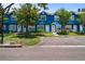 Well-maintained townhome with lush green landscaping and a designated parking area at 3350 Fox Hunt Dr, Palm Harbor, FL 34683