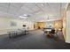 Spacious game room with ping pong table, billiard table, and a cozy seating area for fun gatherings and entertainment at 3350 Fox Hunt Dr, Palm Harbor, FL 34683