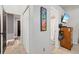 Hallway leads to bathroom, complemented by a framed video game art piece at 3350 Fox Hunt Dr, Palm Harbor, FL 34683