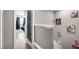 Hallway with dark doors and artwork at 3350 Fox Hunt Dr, Palm Harbor, FL 34683
