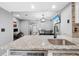 Bright kitchen featuring granite counters, modern appliances, and open layout at 3350 Fox Hunt Dr, Palm Harbor, FL 34683