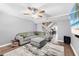 Cozy living room with plush seating, modern decor, and hardwood flooring at 3350 Fox Hunt Dr, Palm Harbor, FL 34683