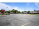 Expansive view of Sutherland Elementary School featuring a vast parking lot, school building, and well-maintained grounds at 3350 Fox Hunt Dr, Palm Harbor, FL 34683
