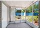 Enclosed patio with door to the backyard at 3350 Fox Hunt Dr, Palm Harbor, FL 34683