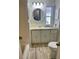 This is a bathroom with light colored cabinets and drawers and a framed mirror at 34645 Camphor N Dr, Pinellas Park, FL 33781