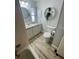 This is a bathroom with light colored cabinets and drawers plus plants on shelves at 34645 Camphor N Dr, Pinellas Park, FL 33781