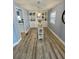 Bright dining room area with built-in shelving and modern decor at 34645 Camphor N Dr, Pinellas Park, FL 33781