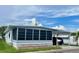 Charming single-story home with a screened-in porch and covered parking area at 34645 Camphor N Dr, Pinellas Park, FL 33781