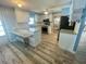 Well-lit kitchen boasts granite counters, stainless appliances, and ample cabinet space at 34645 Camphor N Dr, Pinellas Park, FL 33781