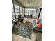 Inviting sunroom featuring wicker furniture, bright colors, and ample natural light at 34645 Camphor N Dr, Pinellas Park, FL 33781