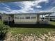 Backyard view of the property, showing the exterior wall and surrounding landscape, creating a serene outdoor space at 35020 Colony Hills Dr, Zephyrhills, FL 33541