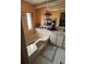 Relaxing bathroom featuring a garden tub with jets, peach walls, and a large vanity area at 35020 Colony Hills Dr, Zephyrhills, FL 33541