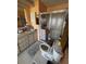 Bathroom featuring a shower with glass doors, peach walls, and a sink with storage at 35020 Colony Hills Dr, Zephyrhills, FL 33541