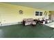 Inviting covered carport with cozy seating, perfect for enjoying the outdoors in comfort and style at 35020 Colony Hills Dr, Zephyrhills, FL 33541