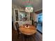 Cozy dining area with a vintage chandelier and glass-door cabinets at 35020 Colony Hills Dr, Zephyrhills, FL 33541